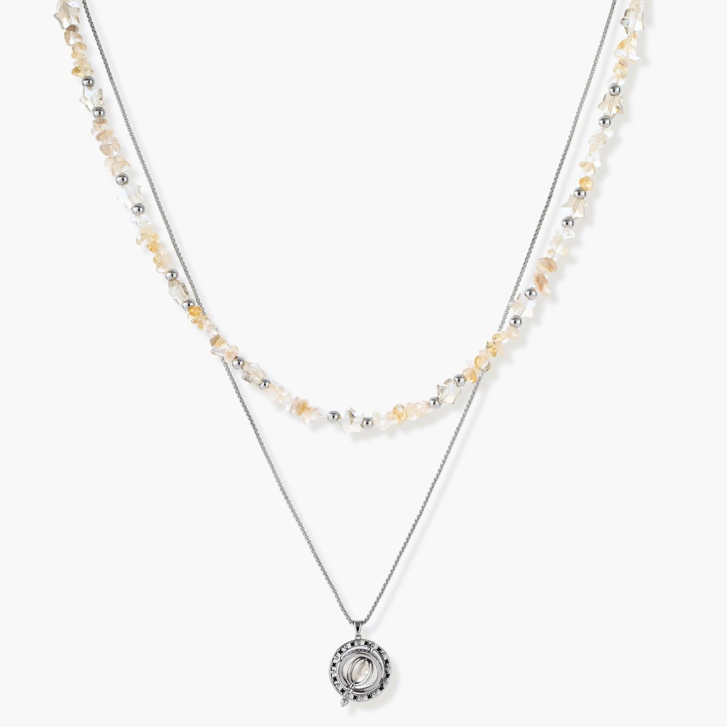 Two-layer necklace with natural stone chips and eco-brass beads, featuring a circular wrapped pendant on cream background.