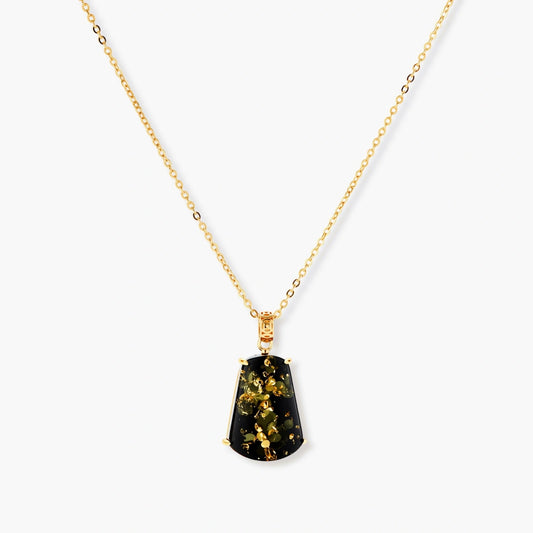 18k gold-plated necklace and earrings with green amber pendants featuring golden inclusions on cream background
